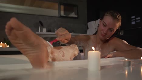 Caucasian-woman-taking-bath-in-hotel