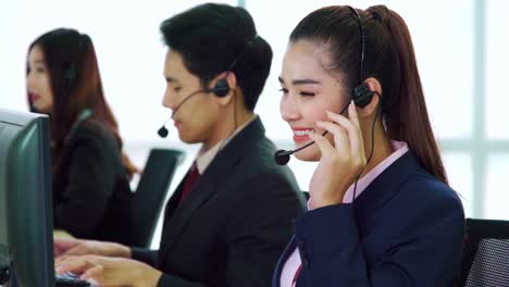 business people wearing headset working in office