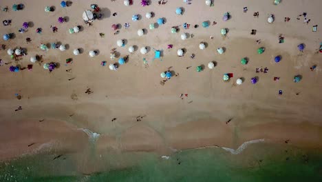 a static aerial view of visitors using umbrellas at the shek o beach in hong kong as public beaches reopening, after months of closure amid coronavirus outbreak, to the public