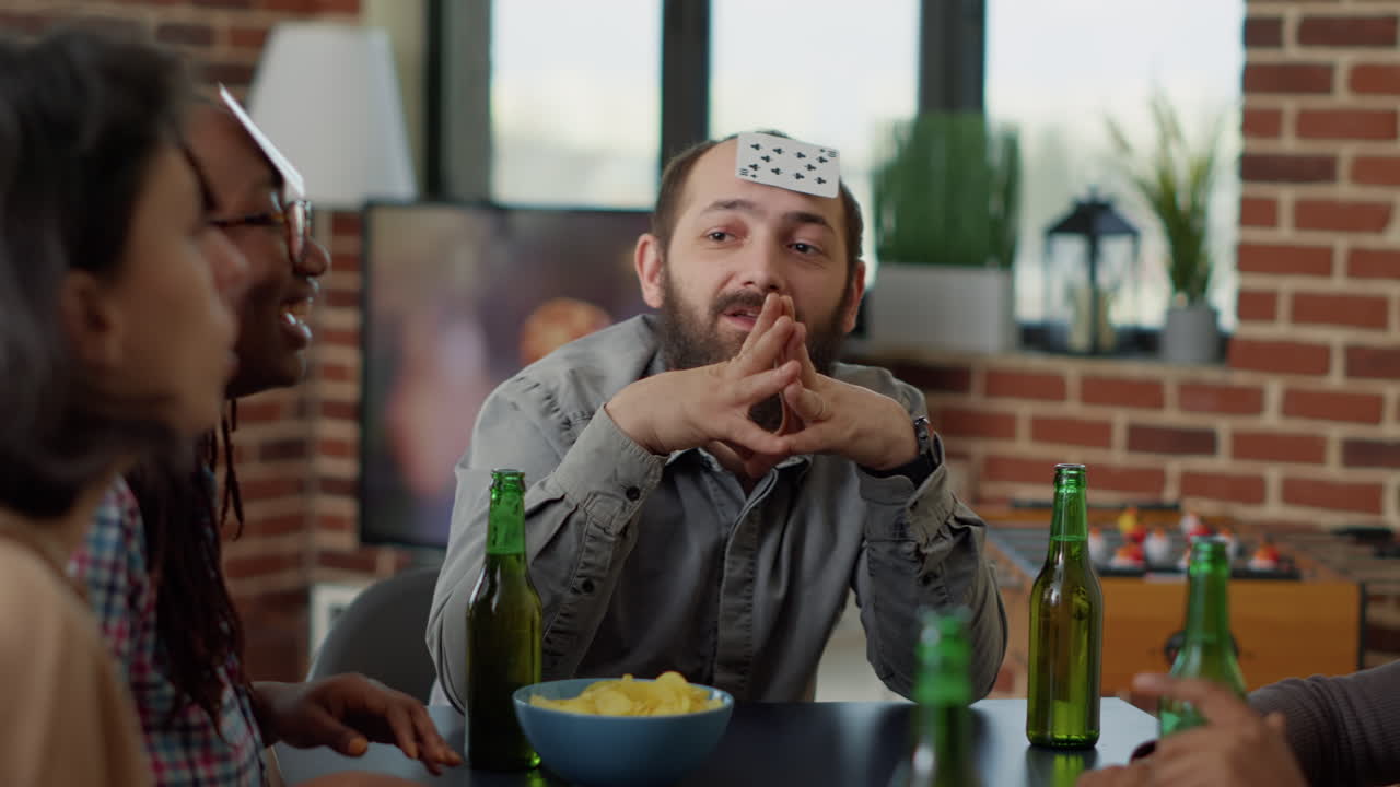 Multiethnic group of people laughing together at board games