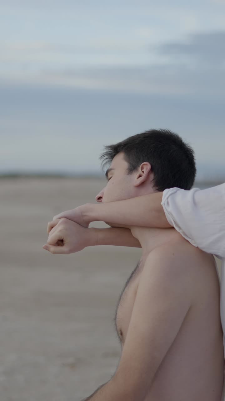 Couple Sharing a Tender Embrace on a Beach