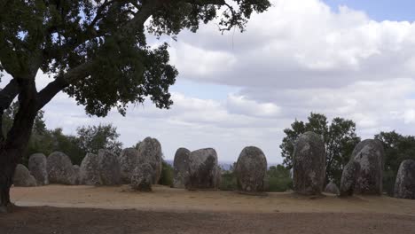 cromlech of almendres megalithic stone complex with cork trees in alentejo, portugal