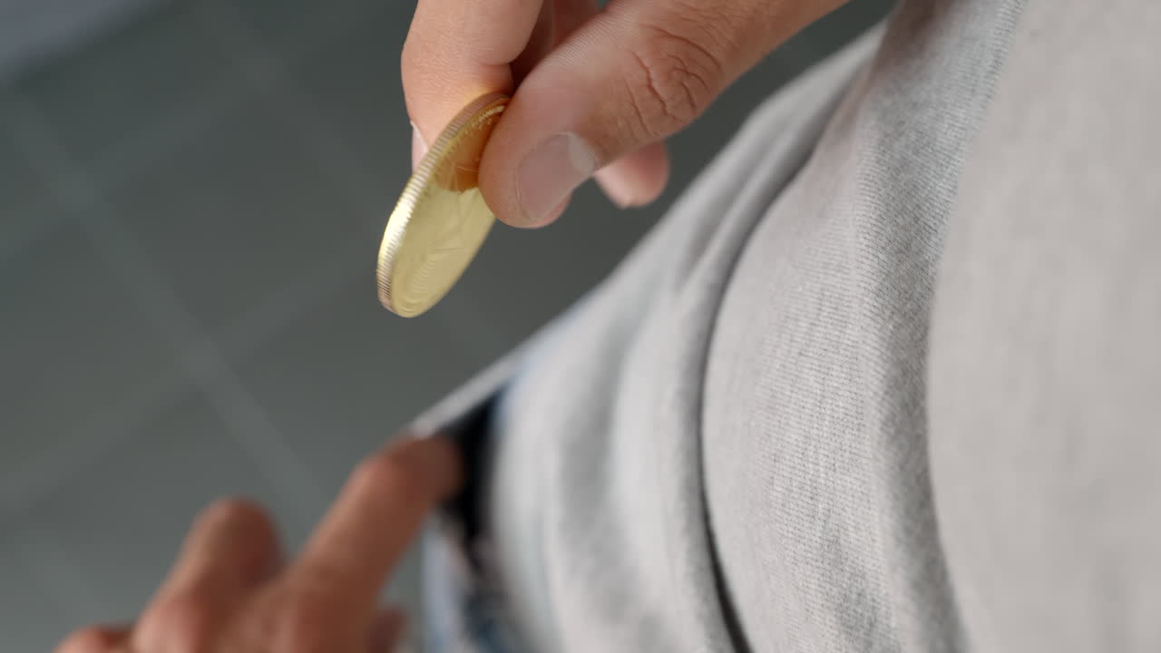 A physical Ethereum coin being put into a