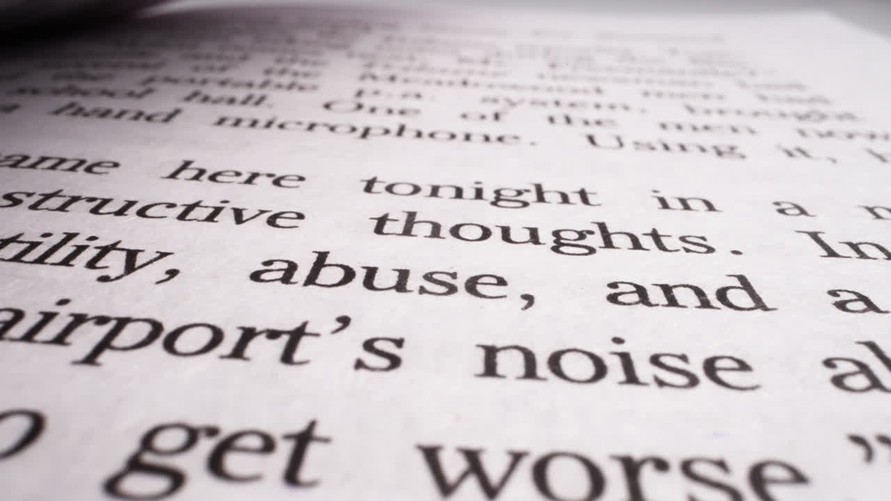 Page of novel book with printed text in light studio macro