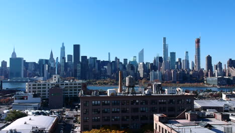 Waterfront-High-rise-Buildings-In-Hunter's-Point-Across-East-River-With-Blue-Sky-In-Background-In-Long-Island-City,-NYC,-USA