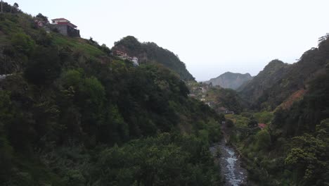 Drone-view-of-hills-and-river-in-Madeira,-Portugal