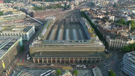 aerial top-down view of lucerne’s main bus terminal and train station at golden hour