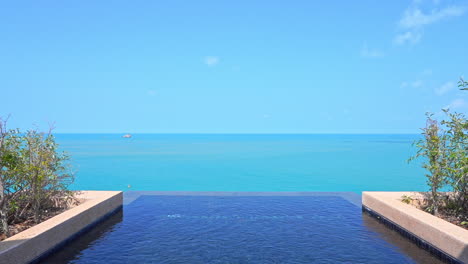 empty luxury rooftop private infinity pool with a view of the ocean on a sunny day, in bali, vacation template