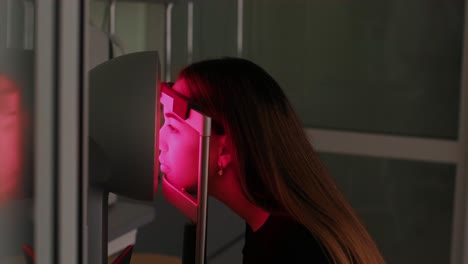 corneal topography. eye exam with corneal analyzer for beautiful woman