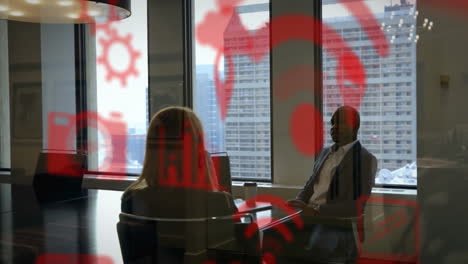 red technology icons animation over business meeting in office with city view