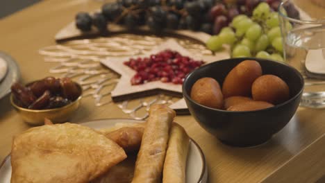 close up of food on muslim family table in home set for meal celebrating eid 13