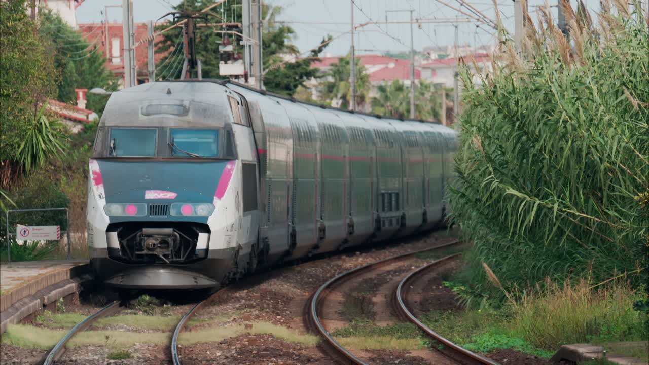 Nice, France - October 24, 2024: Close up of a blue train moving on the rails