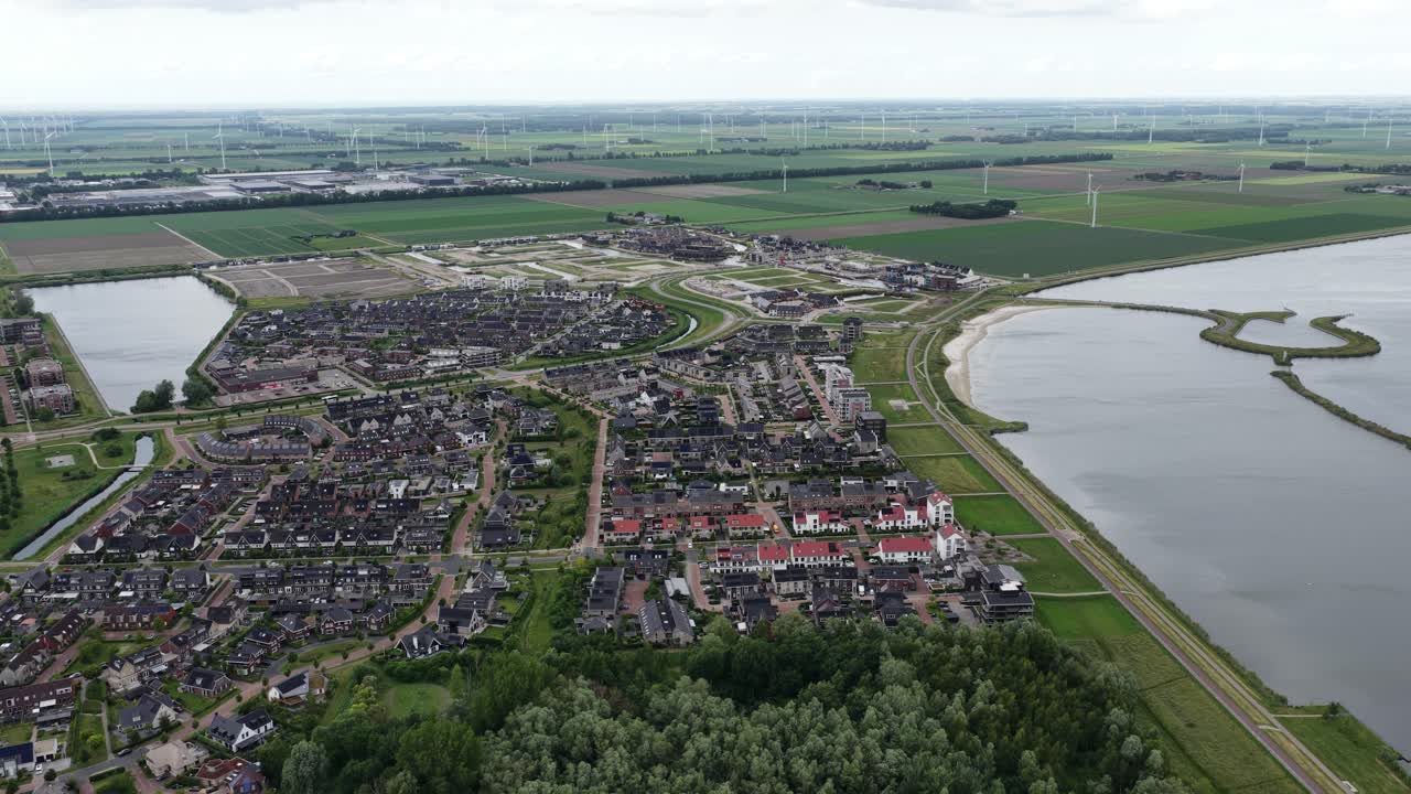 Zeewolde, flevoland, The Netherlands, new residential area along the wolderwijd. Aerial video