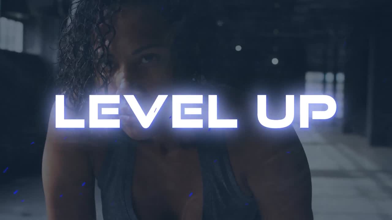 Animation of level up text over mixed race woman exercising indoors