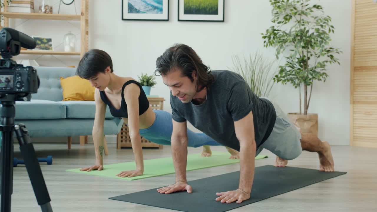 Couple Doing Yoga Plank Exercise at Home
