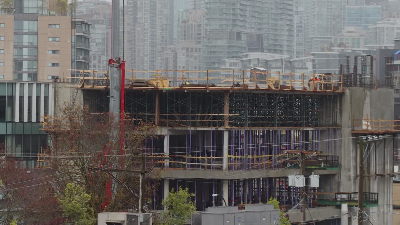 Construction set and builders in Vancouver on a rainy day time-lapse 4K