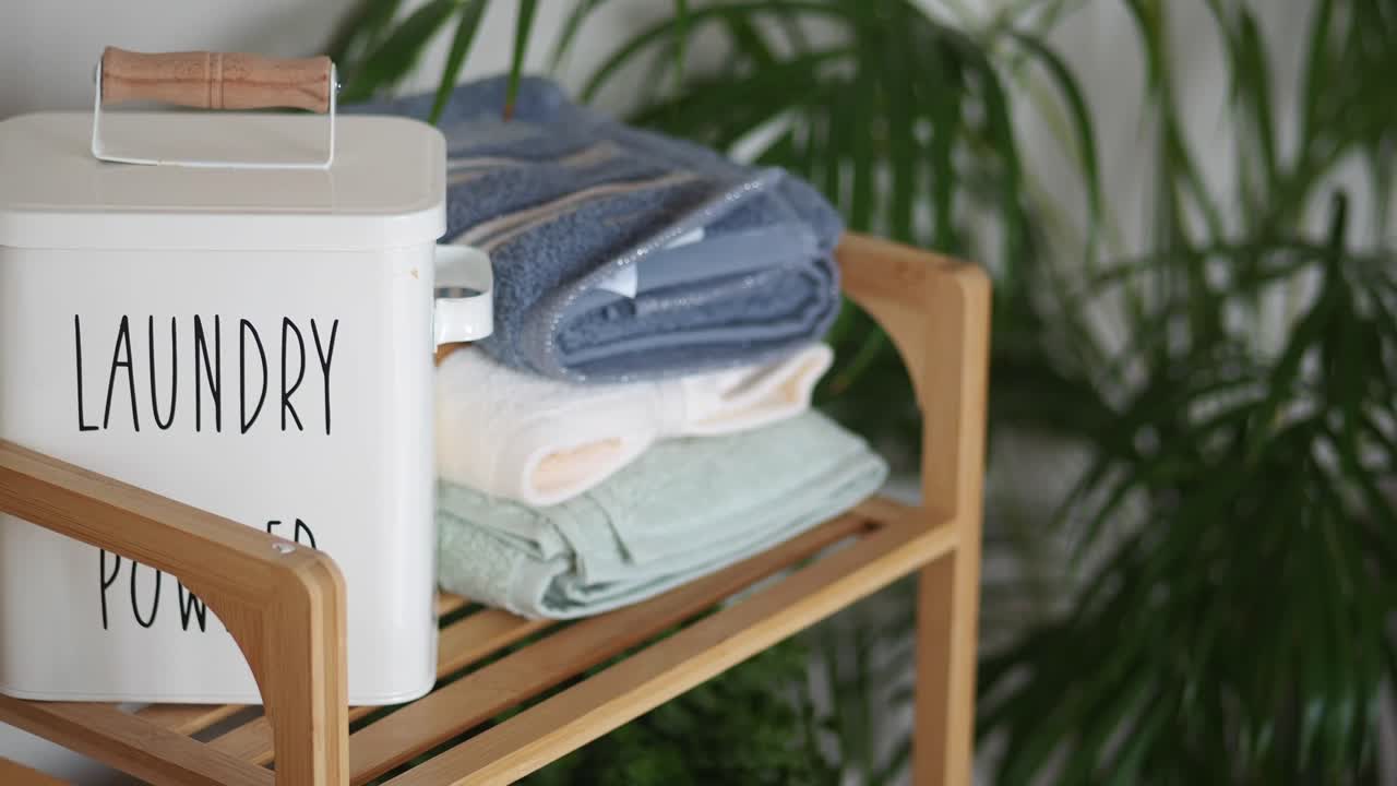 Laundry Powder and Towels on Shelf