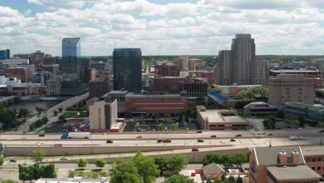 grand rapids, michigan skyline with freeway and cars moving with drone video stable