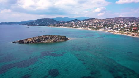 amazing turquoise water in the agean coast of attica sunio filmed by drone