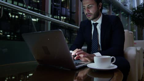 arabic businessman working laptop technology night hotel lobby