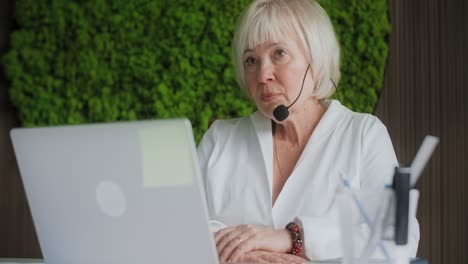 senior woman in conference call