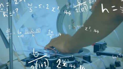 Animation-of-mathematical-equations-over-biracial-male-scientist-working-in-lab