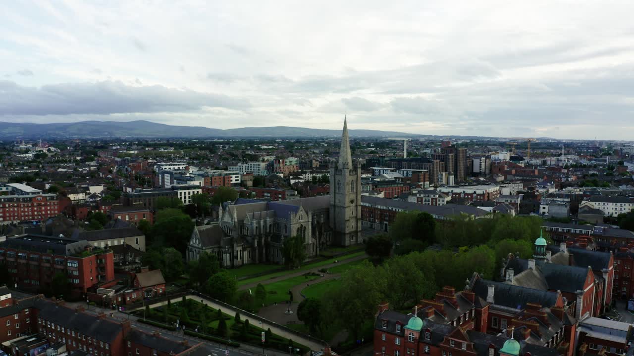 Wide aerial shot approaching a cathedral in Dublin, Ireland.