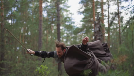 Bearded-man-with-flying-cape-falls-down-defeated-by-enemy