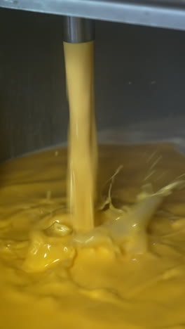 industrial making cheese in big factory. producing butter food industry. vertical video