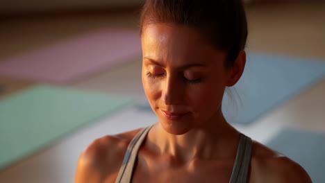 woman meditating after yoga session
