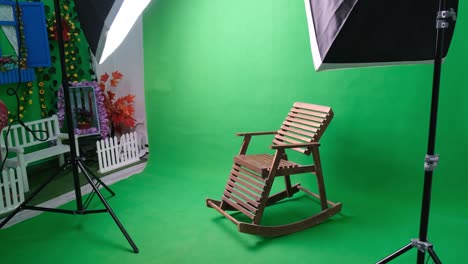 photo or video studio with two hexagone studio lights. green screen and fixed chair