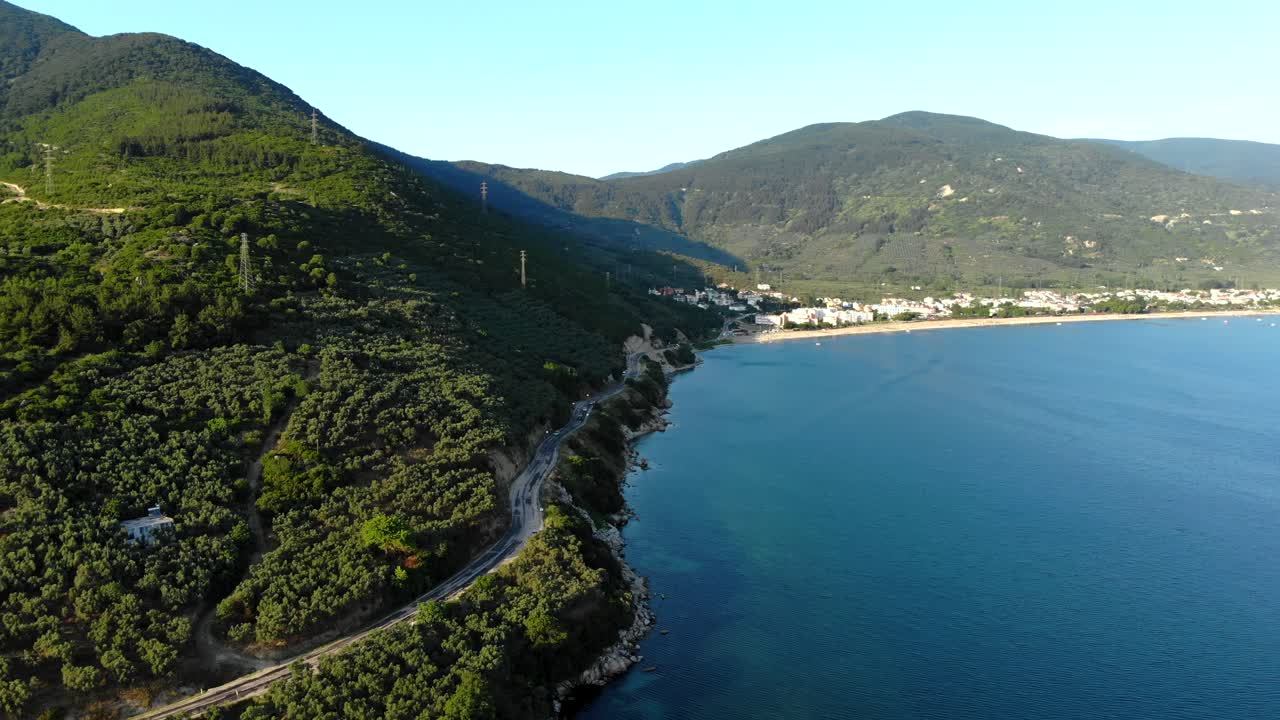 Aerial rearward flight over Marmara sea with captvating mountain view, Balikesir, Turkey