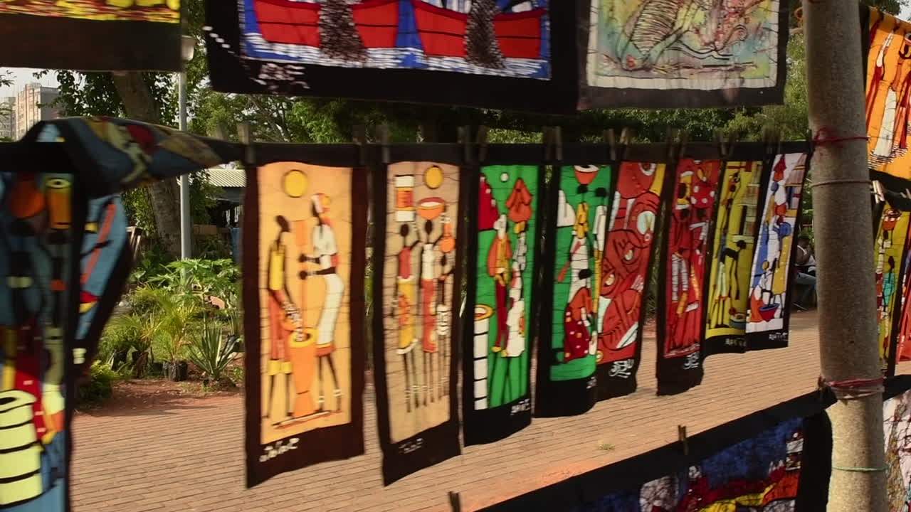 Vibrant African Batik Textiles on Display at an Outdoor Market
