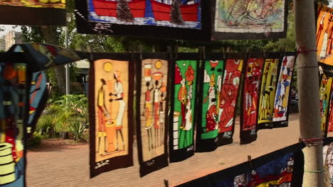 vibrant african batik textiles on display at an outdoor market