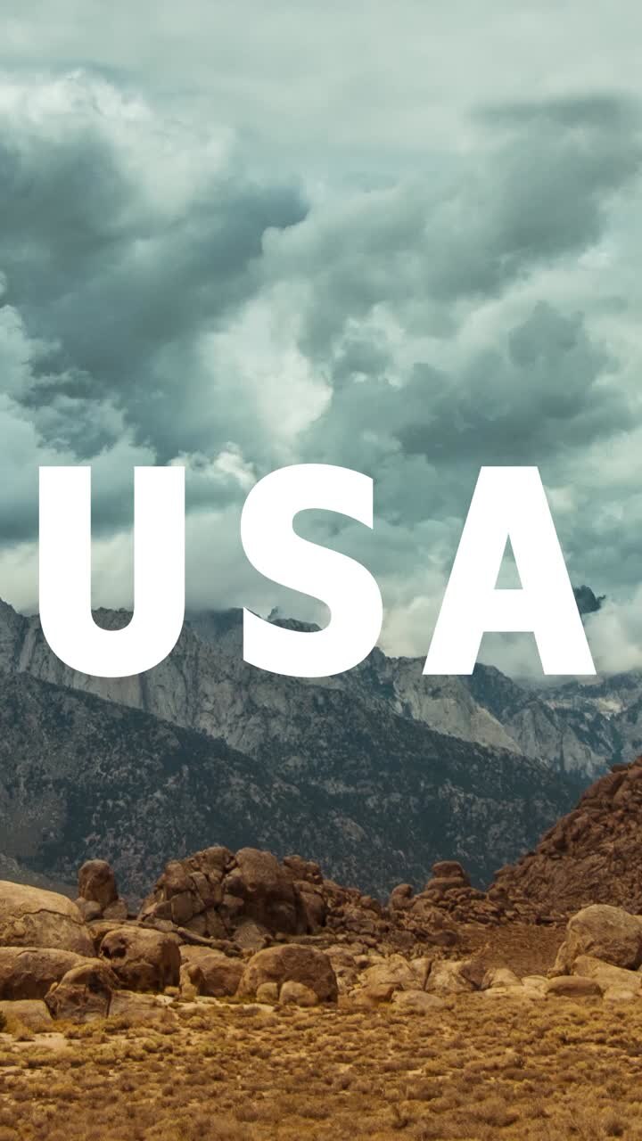 Vertical Video Of Mountains And Desert Landscape In American National Park Overlaid With Animated Graphic Spelling Out USA