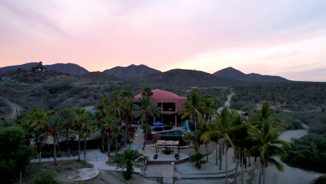 dronie shot of an hotel at san jose del cabo in mexico near the beach