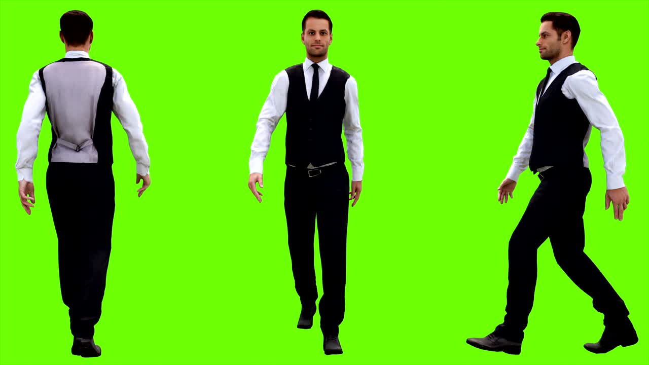 Young businessman walking on a green screen background. Looped animation. 4k