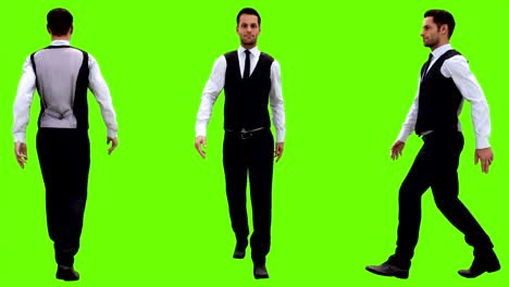young businessman walking on a green screen background. looped animation. 4k