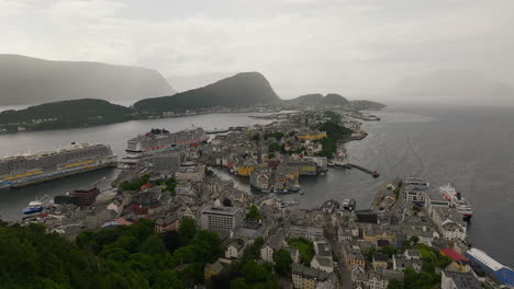 cruise liners docked at sea port of ålesund on geirangerfjord, norway