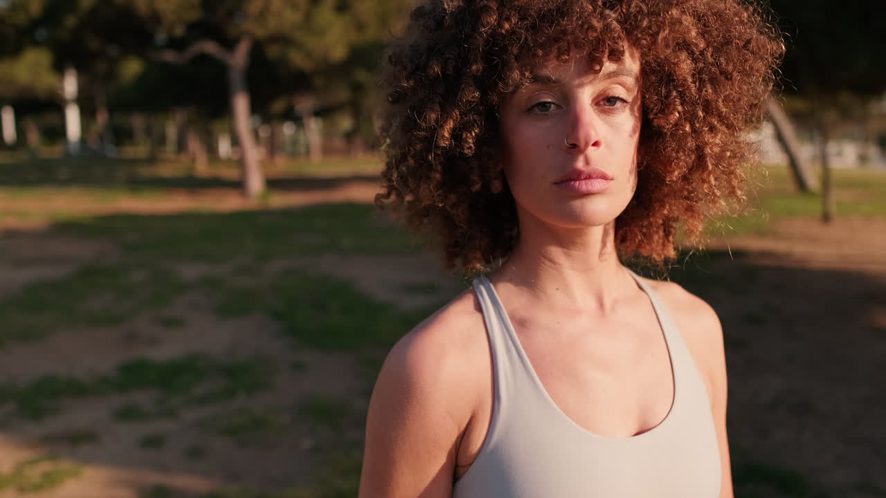 Young Woman in Sportswear at a Park