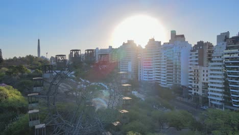 Aerial-view-with-sun-flares-of-Cordoba-Rueda-Eiffel-Ferris-Wheel,-Cordoba,-Argentina