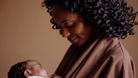 a mother's gentle embrace with her newborn baby