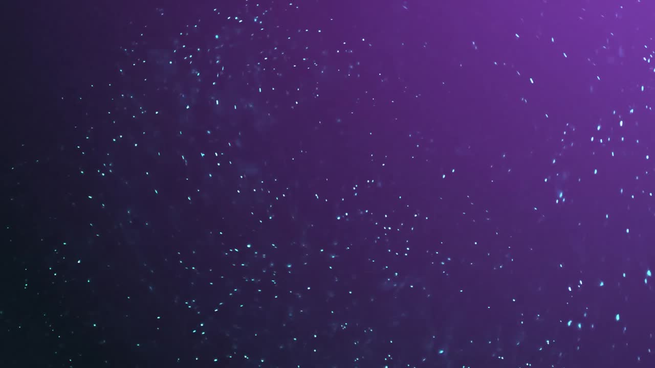 Múltiples partículas brillantes azules y moradas.