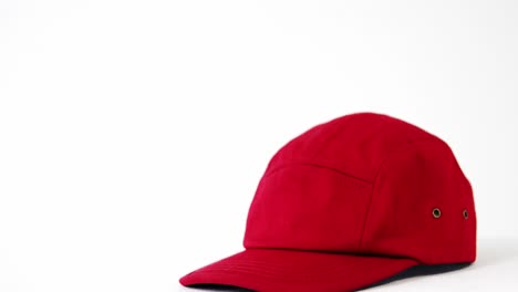 red cap against white background