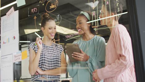 happy diverse business people discussing work during meeting at office