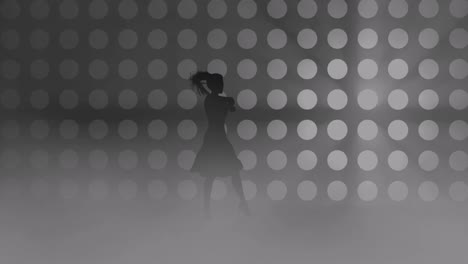 A-modern-youth-dance-performed-by-a-graceful-and-sexy-female-silhouette,-in-the-smoke-against-the-backdrop-of-spotlights