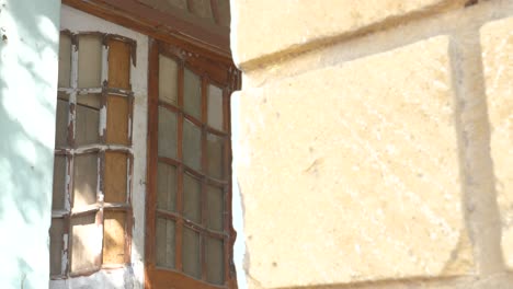 a closeup cinematic shot of closed old doors of goolbai maternity home in karachi, pakistan