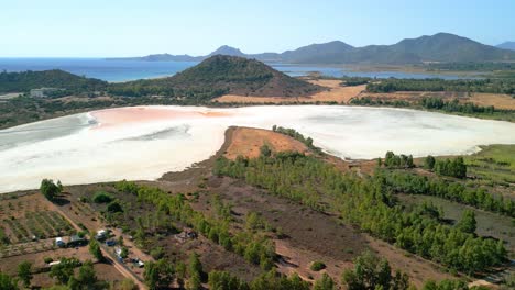 aerial images in sardinia italy dry salt flat mediterranean sea in the background mountains virgin landscape