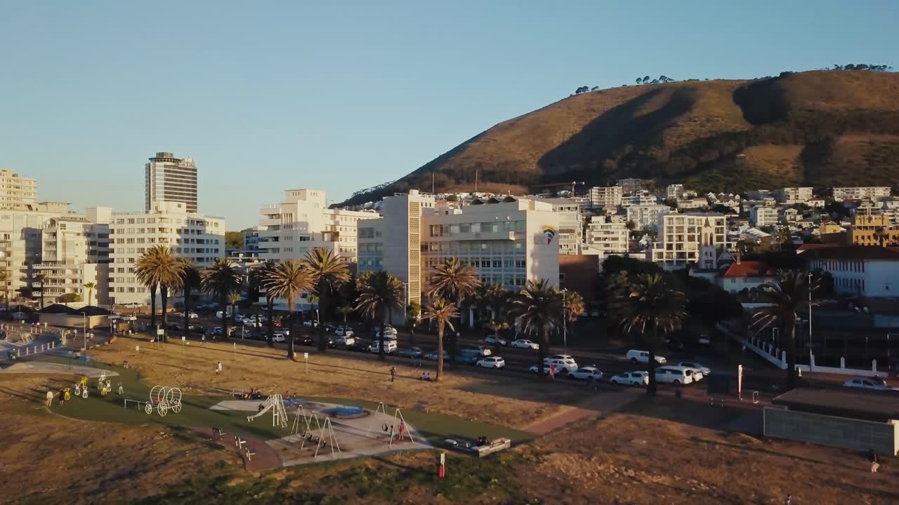 Drone following a busy street near the skyline of Cape Town South Africa