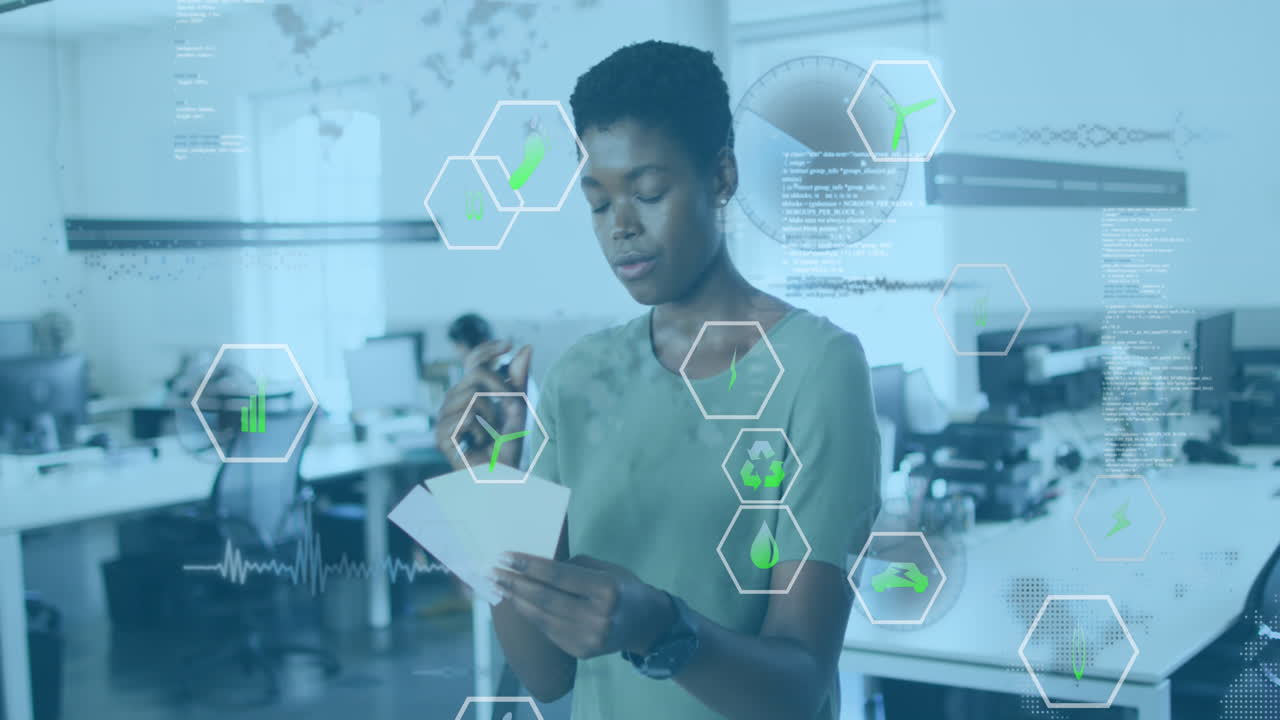 Animation of data processing over african american businesswoman in creative office